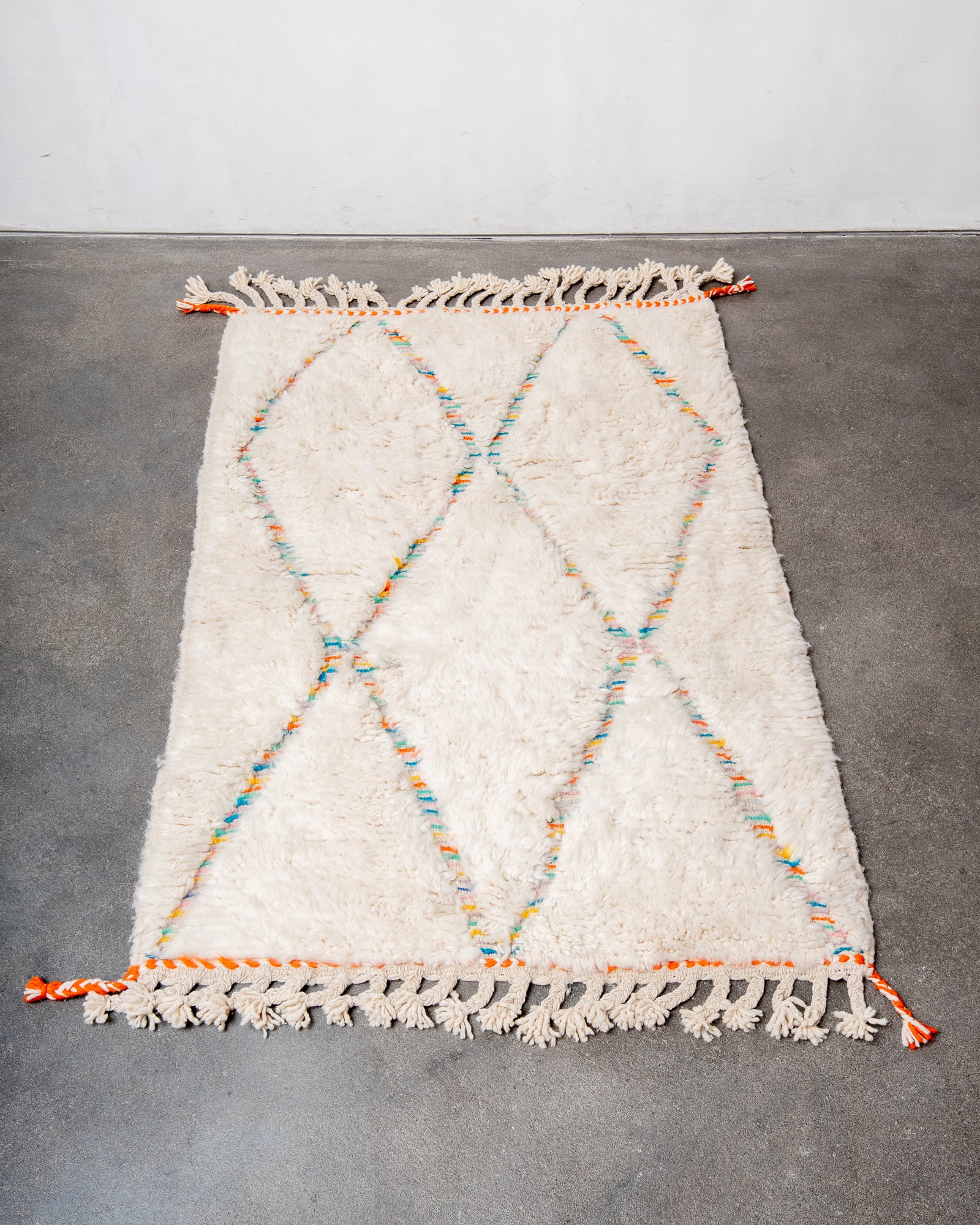Modern, designer, handcrafted Berber rug from Morocco. Beniourain carpet with beautiful colours and patterns and fluffy wool texture.
